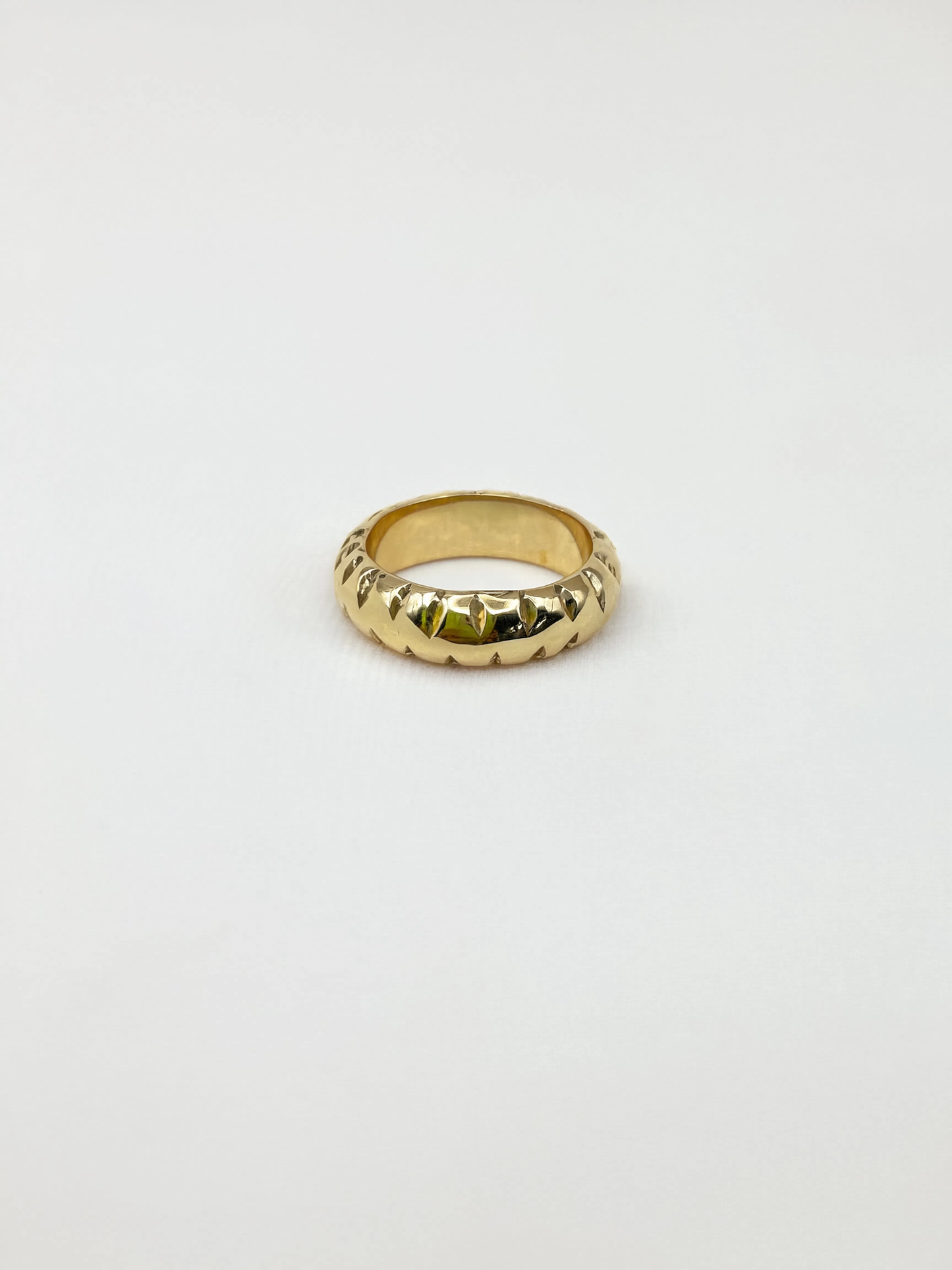Gold ring on a white background
