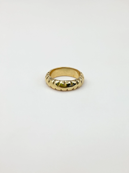 Gold ring on a white background